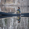 Tori Baird solo paddling a Blue Steel canoe